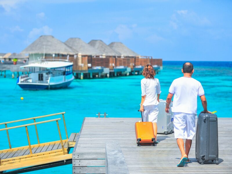 Man and Woman Walks on Dock